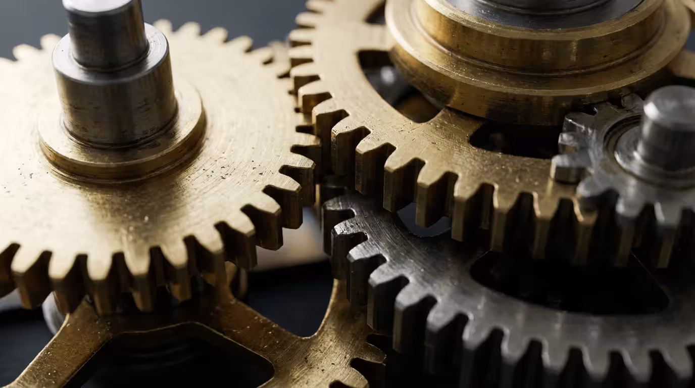 Close-up macro photo of intricate, interlocking metal gears symbolizing strong password security.